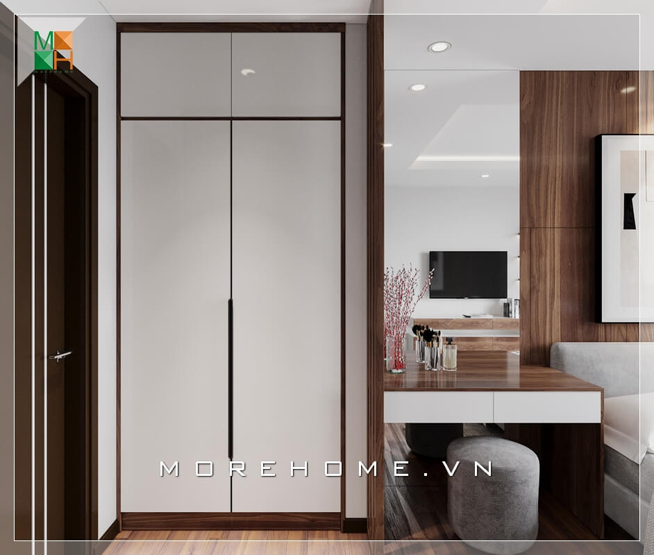 Mẫu tủ quần áo phòng ngủ thiết kế âm tường kịch trần kết hợp với bàn trang điểm và sofa đôn bọc nhung rất hiện đại khiến căn phòng ngủ chung cư, nhà phố trở nên tiện nghi và hiện đại hơn. Thiết kế nội thất phòng ngủ chung cư hiện đại