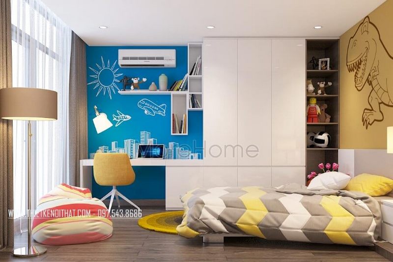 Hệ tủ quần áo được thiết kế nối liền với bàn học giúp tạo nên hiệu ứng khiến căn phòng trở nên rộng hơn.